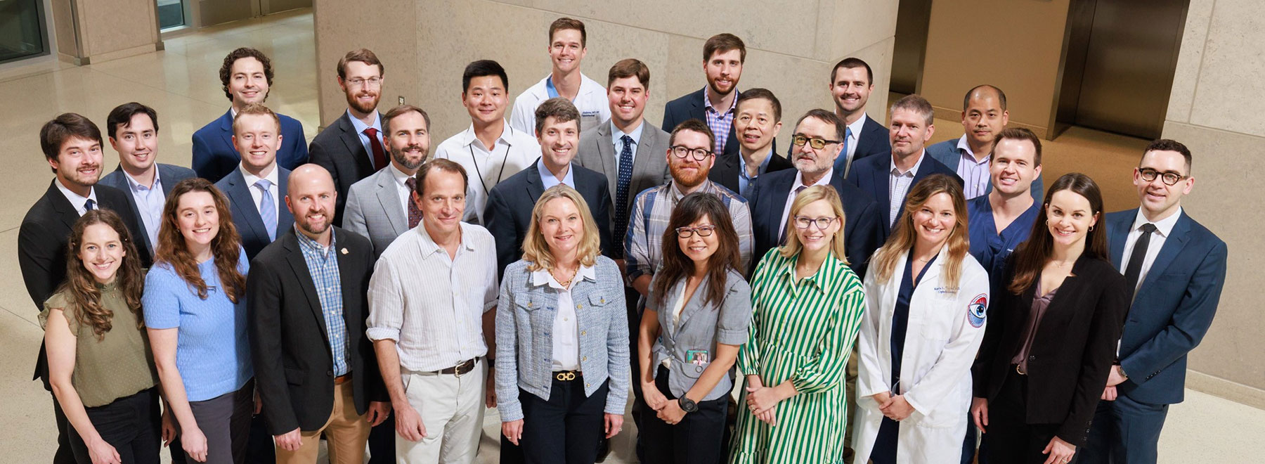 Group portrait of 28 members of the Department of Opthalmology. Group portrait of 28 members of the Department of Opthalmology.